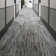 Looking down the row of a commercial carpet office space.